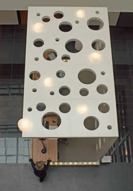 Bespoke stand with holes.